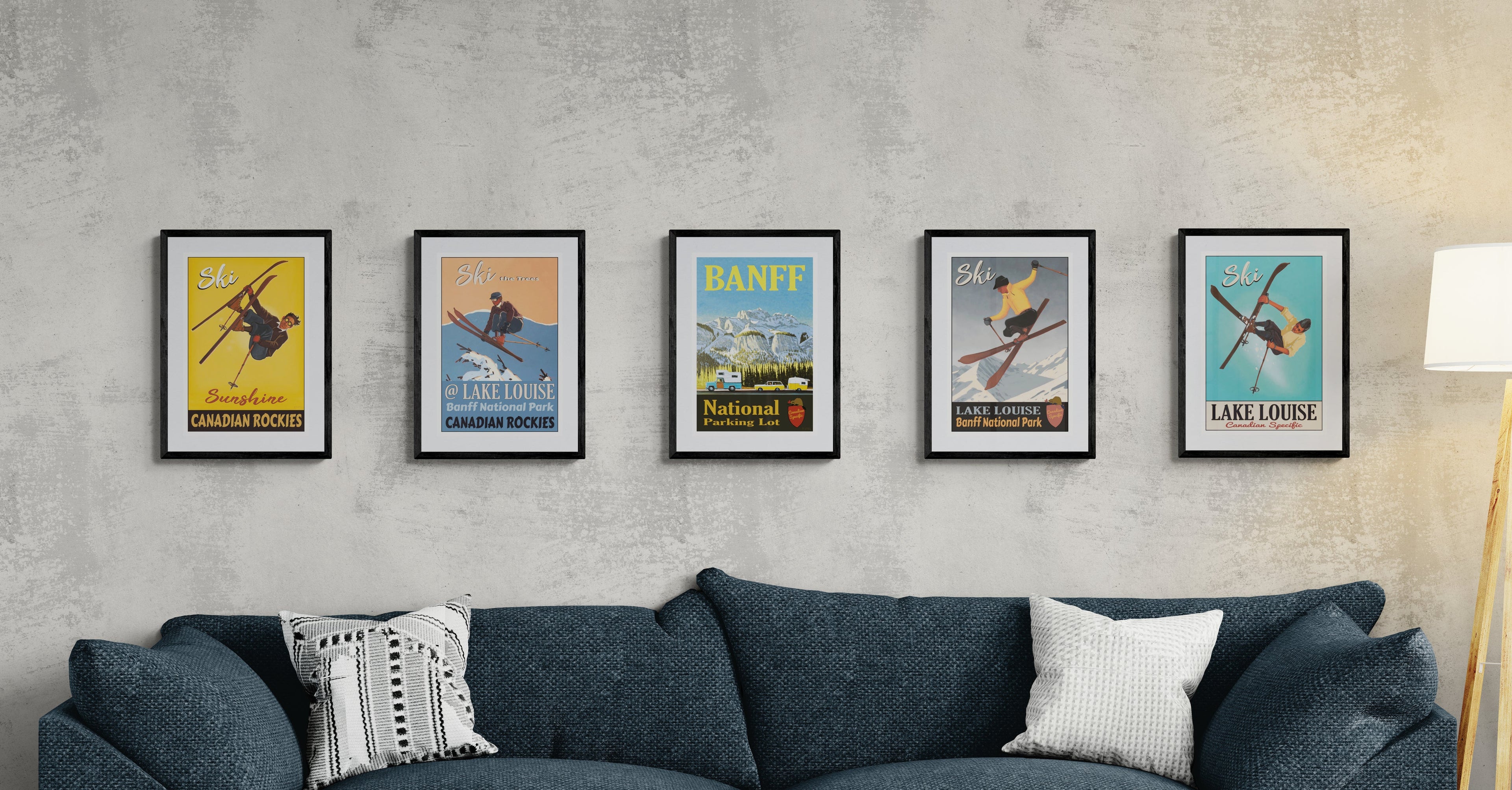 Blue sofa with framed posters on a gray wall